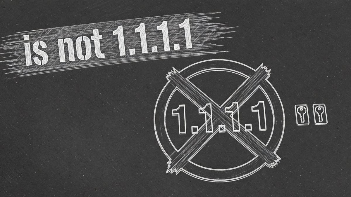 Light chalk X over a 1.1.1.1 circle on dark asphalt, two unmarked locker keys beside it, and the words is not 1.1.1.1